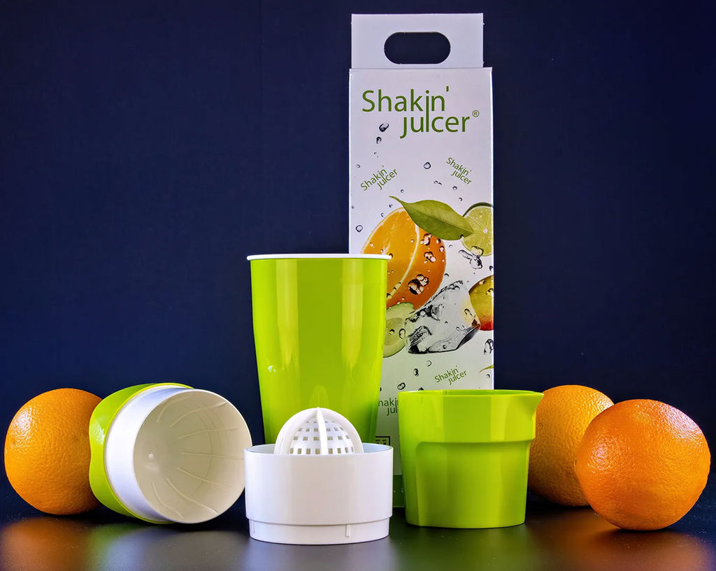 Shakin Juicer mit Orangen und Verpackung
